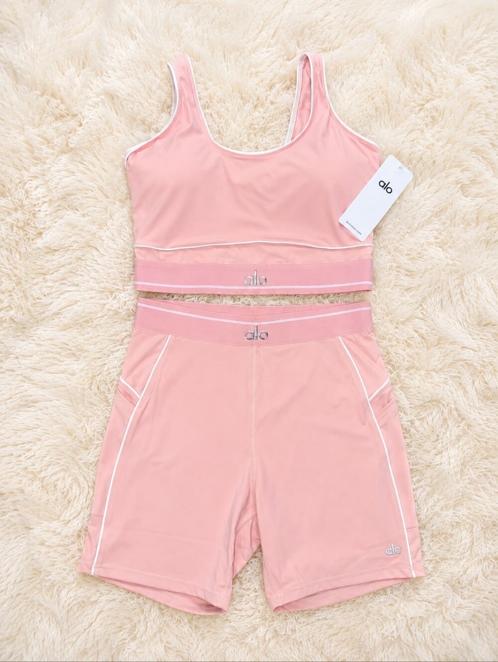 Alo Yoga women’s matching 2-piece activewear set in light pink.